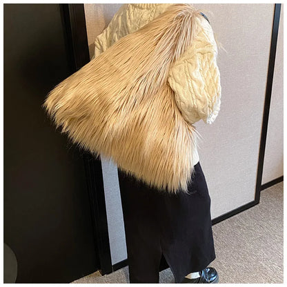 Person wearing a large, fluffy beige hat indoors.