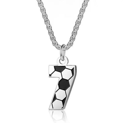 Silver necklace with a black and white hexagonal pendant on a white background