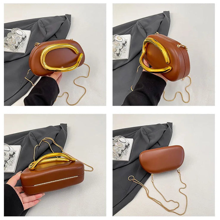 Brown handbag with gold handle held by a person on a white background
