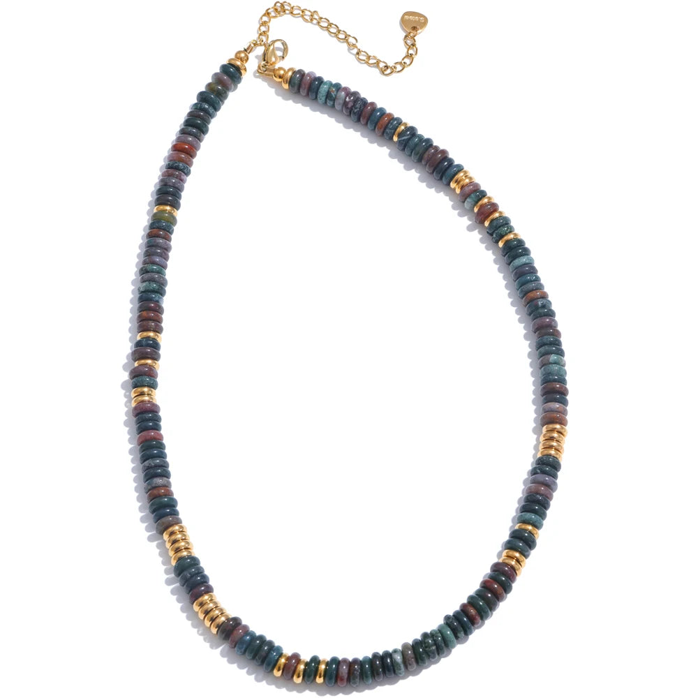 Necklace with multicoloured beads and gold accents on a white background