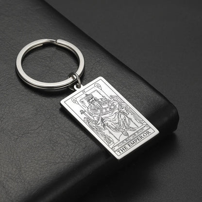 Keychain with tarot card design on a dark surface