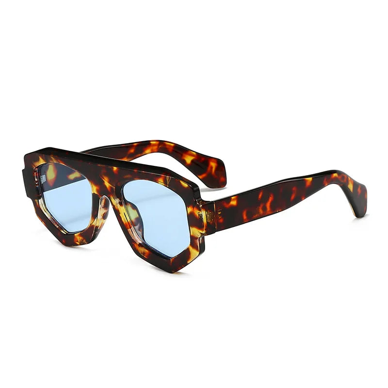 Sunglasses with tortoiseshell frame and blue lenses on a white background