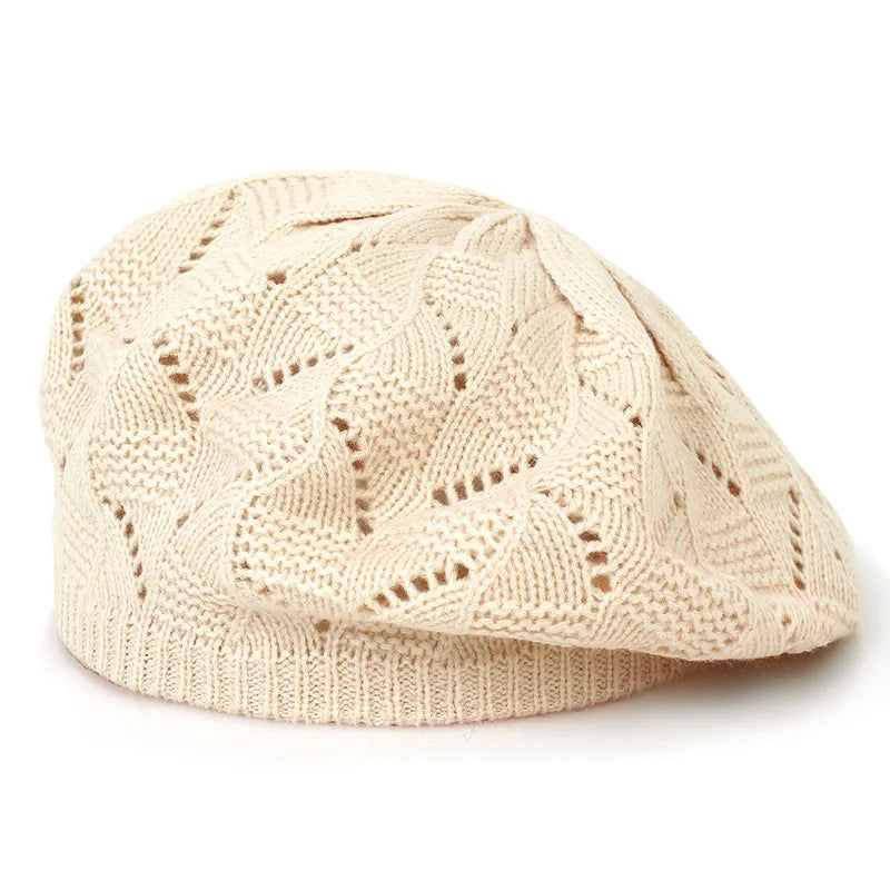 Beige knitted cap on a white background