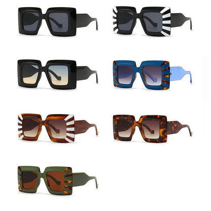 Collection of various sunglasses with different colour combinations on a white background