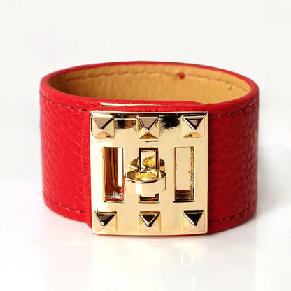 Red leather bracelet with gold clasp on a white background