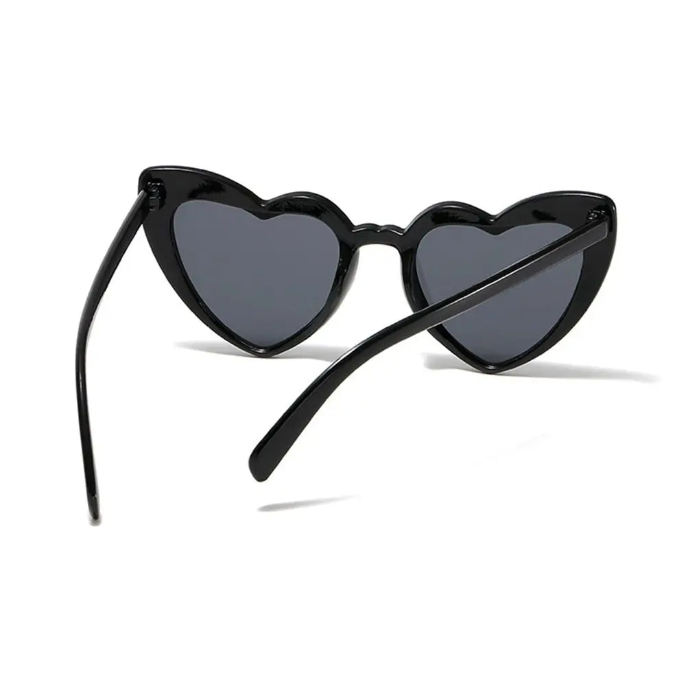 Black heart-shaped sunglasses on a white background