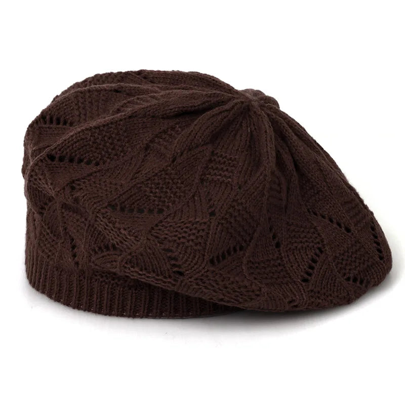 Brown knitted beret on a white background