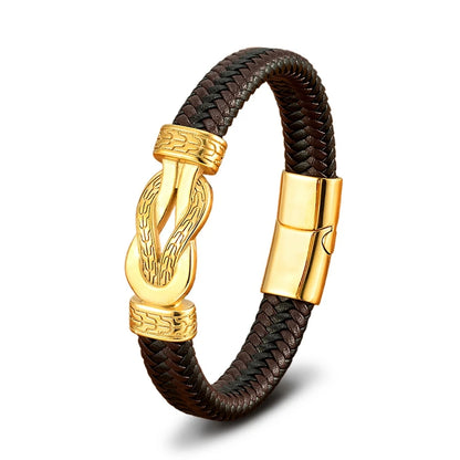 Brown braided leather bracelet with gold clasp on a white background