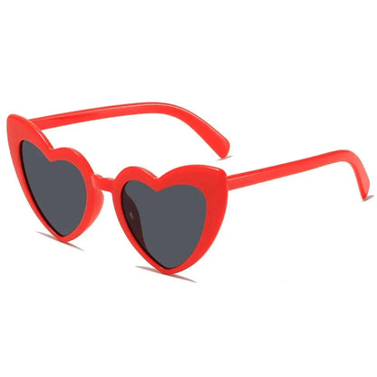 Red heart-shaped sunglasses on a white background