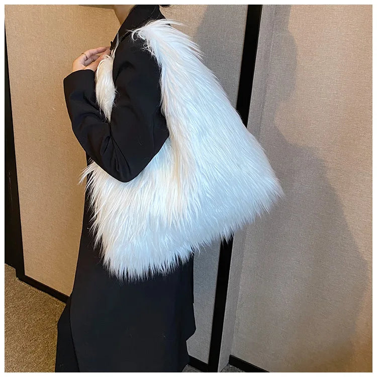 Person wearing a black outfit with a white fur bag against a neutral background