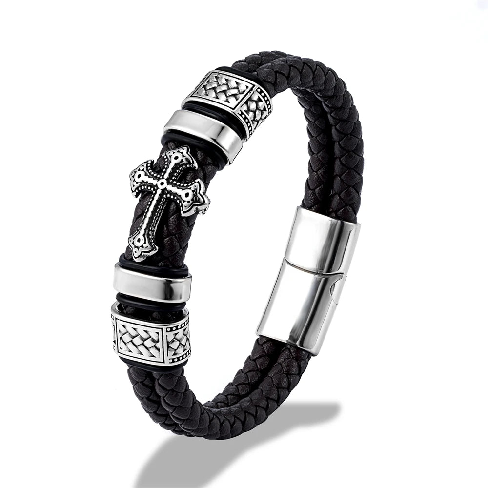 Black braided leather bracelet with silver-tone metal accents, including a cross charm, textured spacer beads, and a magnetic clasp, shown on a white background.