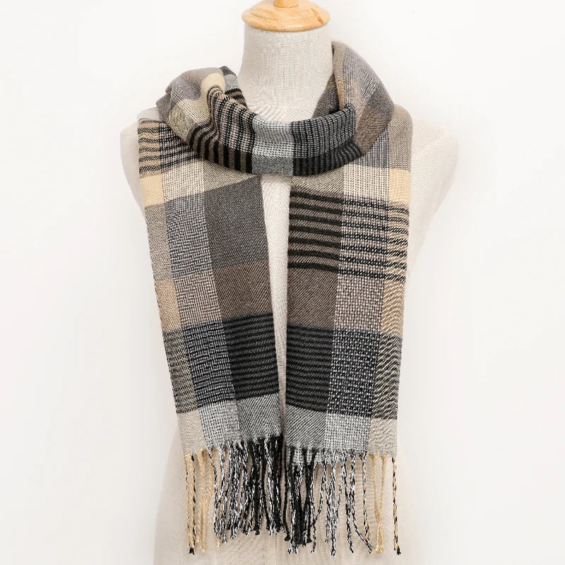 Plaid scarf with fringes on a mannequin against a white background