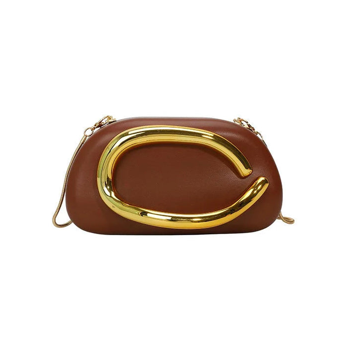Brown handbag with gold handle on a white background