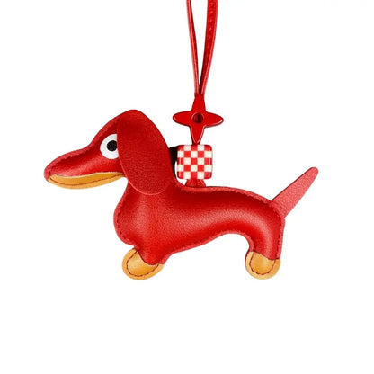 Red dachshund-shaped keychain with a checkered tag on a white background