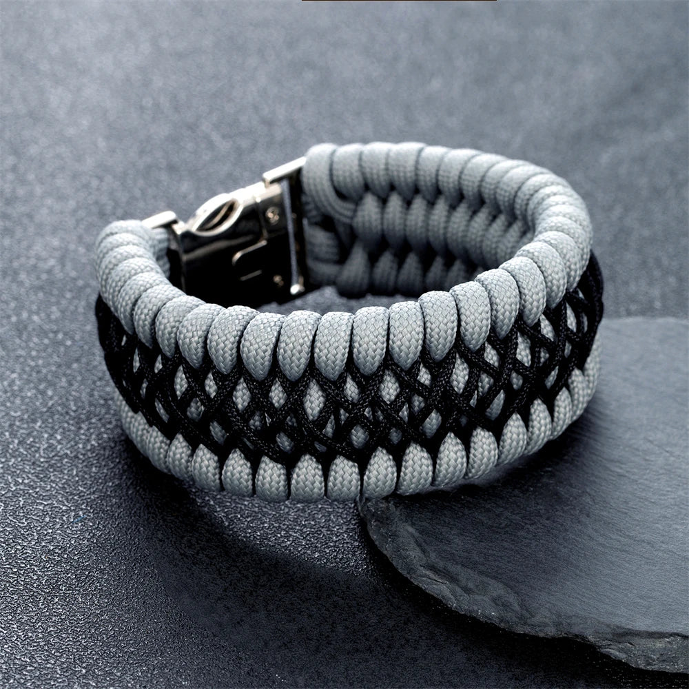 Grey and black braided bracelet on a grey surface