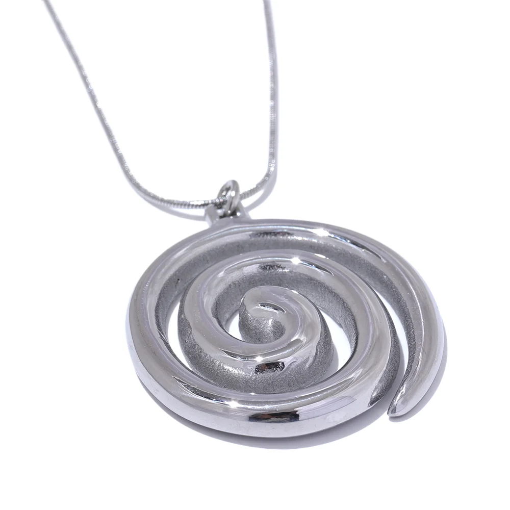 Silver spiral pendant on a chain against a white background