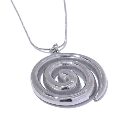 Silver spiral pendant on a chain against a white background