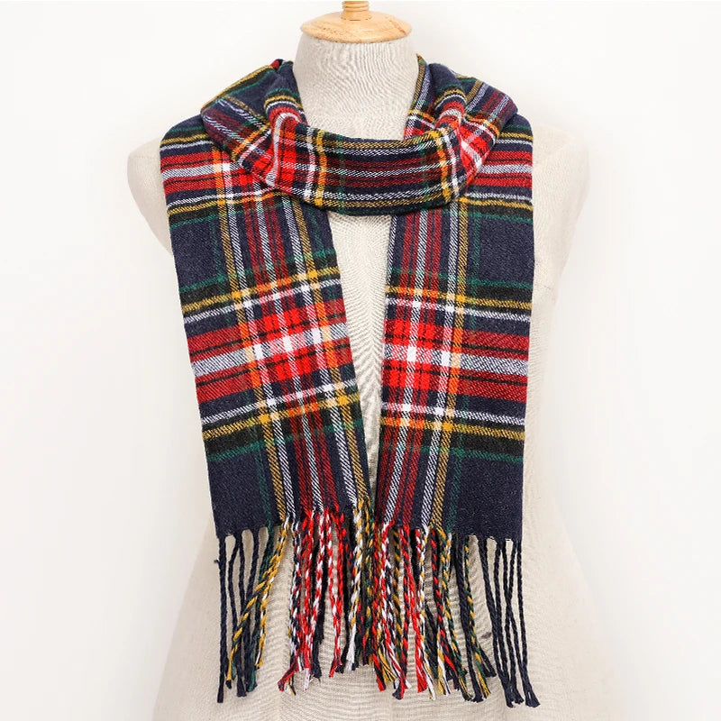 Plaid scarf with fringes on a mannequin against a white background