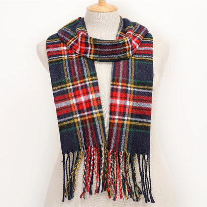 Plaid scarf with fringes on a mannequin against a white background