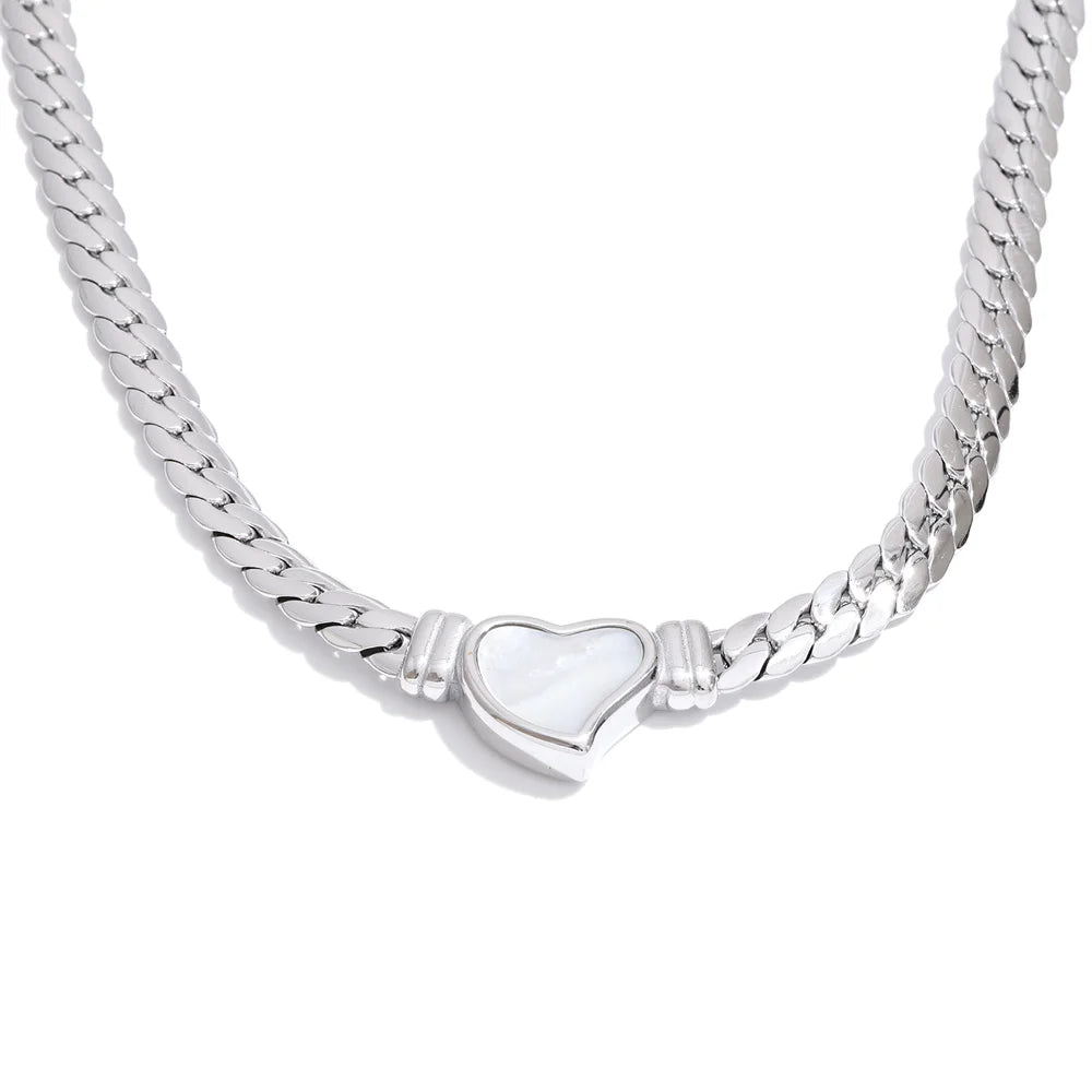 Silver chain necklace with a heart-shaped clasp on a white background