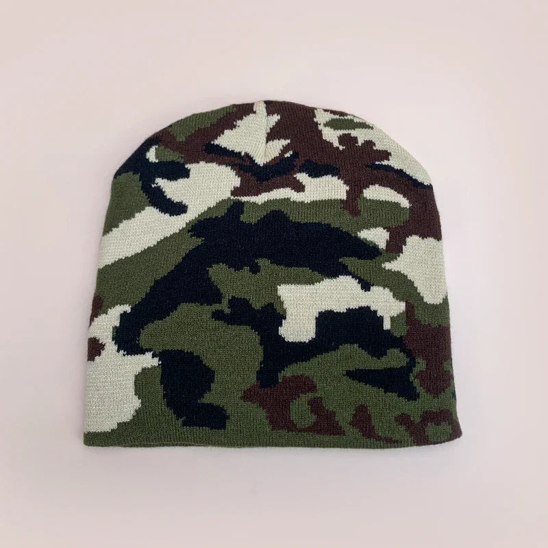 Camouflage-patterned beanie on a light pink background