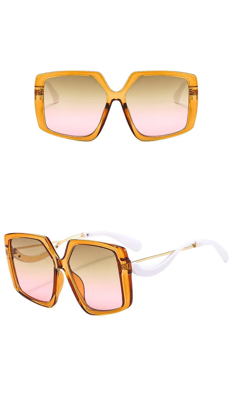 Two views of oversized square sunglasses with amber-orange translucent frames, pink-tinted gradient lenses, and white temple arms on a white background.