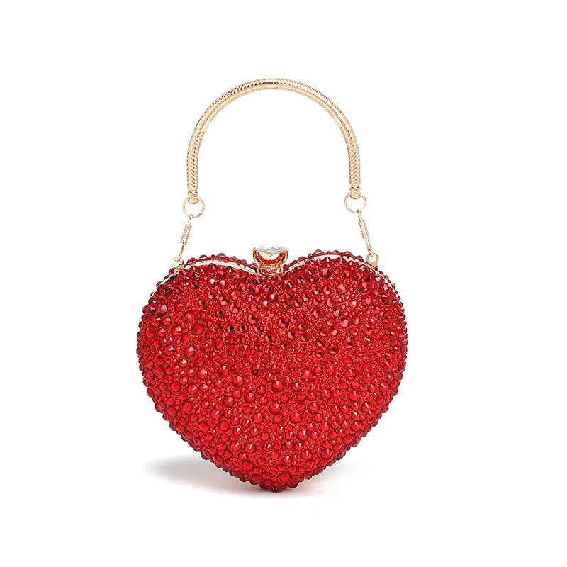 Red heart-shaped handbag with gold handle on a white background