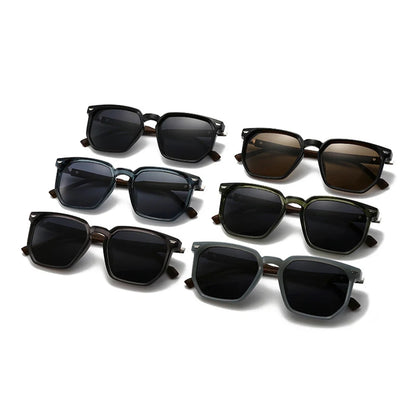 Set of six pairs of sunglasses with different lens colours on a white background