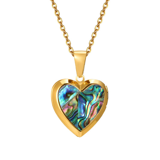 Gold heart-shaped pendant with colourful abalone shell inlay on a gold chain against a white background
