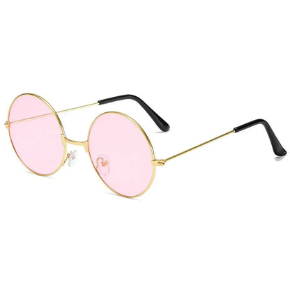 Pink sunglasses with gold frames and black arms on a white background