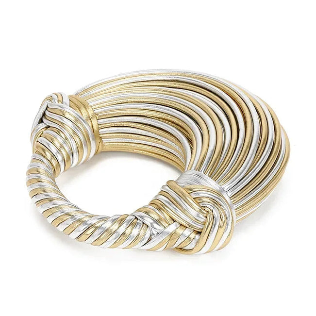 Gold and silver handbag on a white background