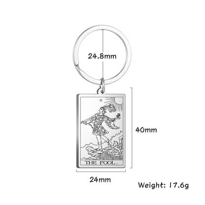 Keychain with tarot card design and measurements on a white background
