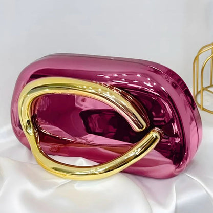 Purple handbag with gold handle on a white background
