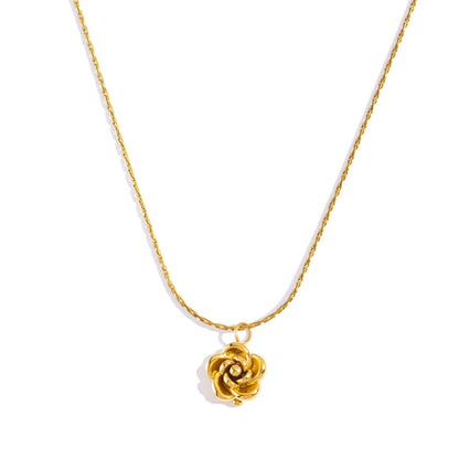 Gold necklace with a rose-shaped pendant on a white background