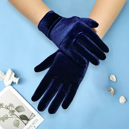 Navy blue gloves on a light blue background with decorative elements.
