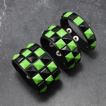 Black and green checkered bracelets on a dark grey background