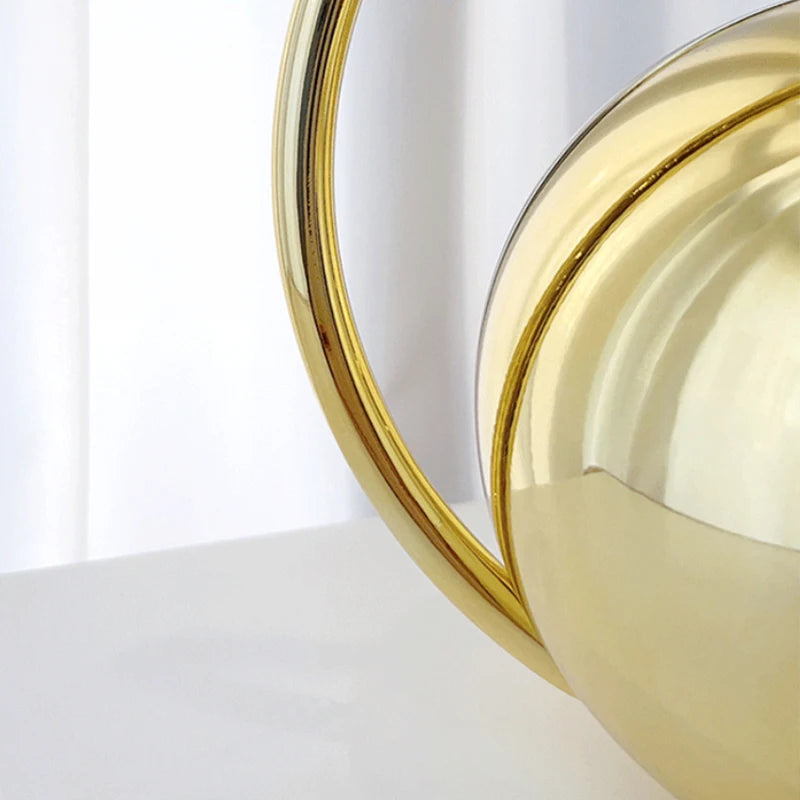 Close-up gold clutch bag on a white background