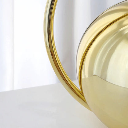 Close-up gold clutch bag on a white background