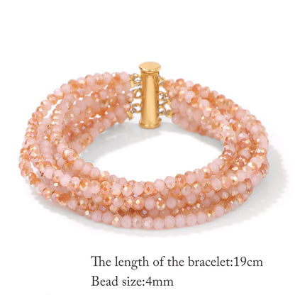 Multistrand beaded bracelet with gold clasp on a white background