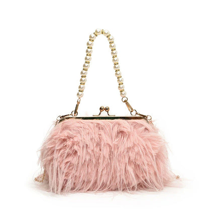 Pink feathered handbag with pearl handle on a white background