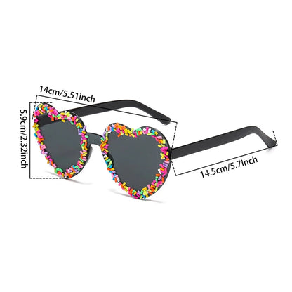 Heart-shaped sunglasses with colourful sprinkles and measurements on a white background