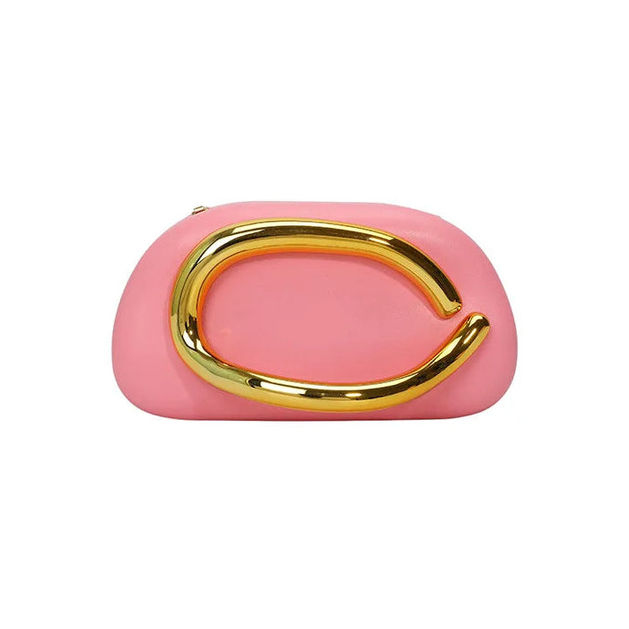 Pink clutch bag with a gold buckle handle on a white background