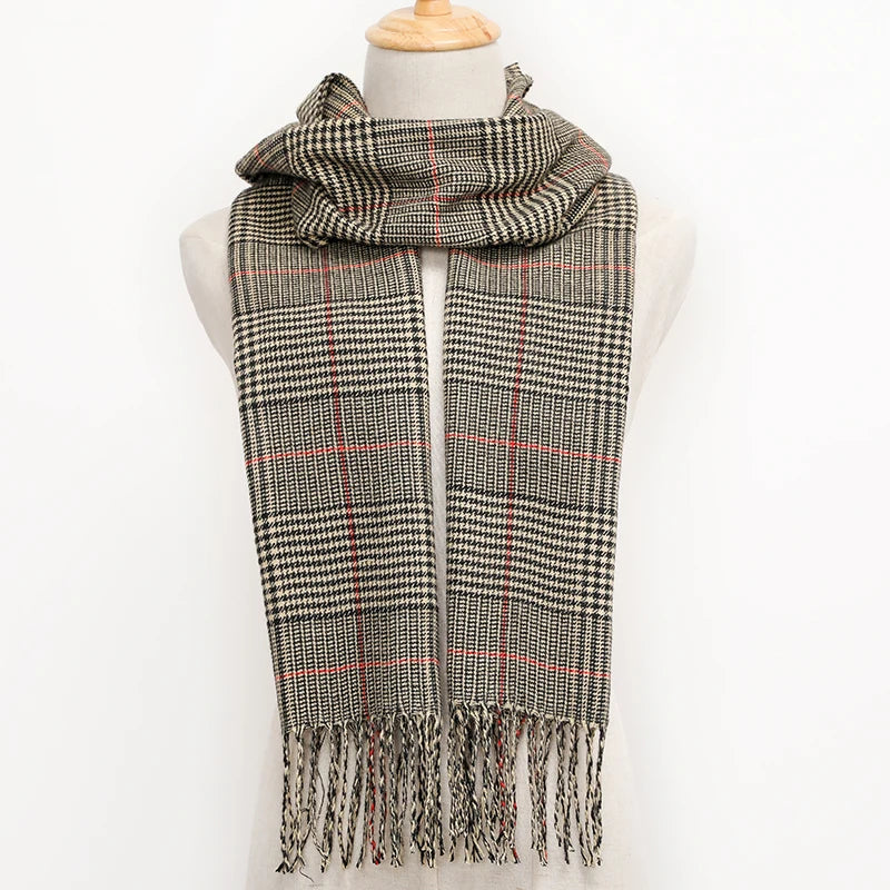Plaid scarf with fringes on a mannequin against a white background