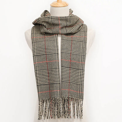 Plaid scarf with fringes on a mannequin against a white background
