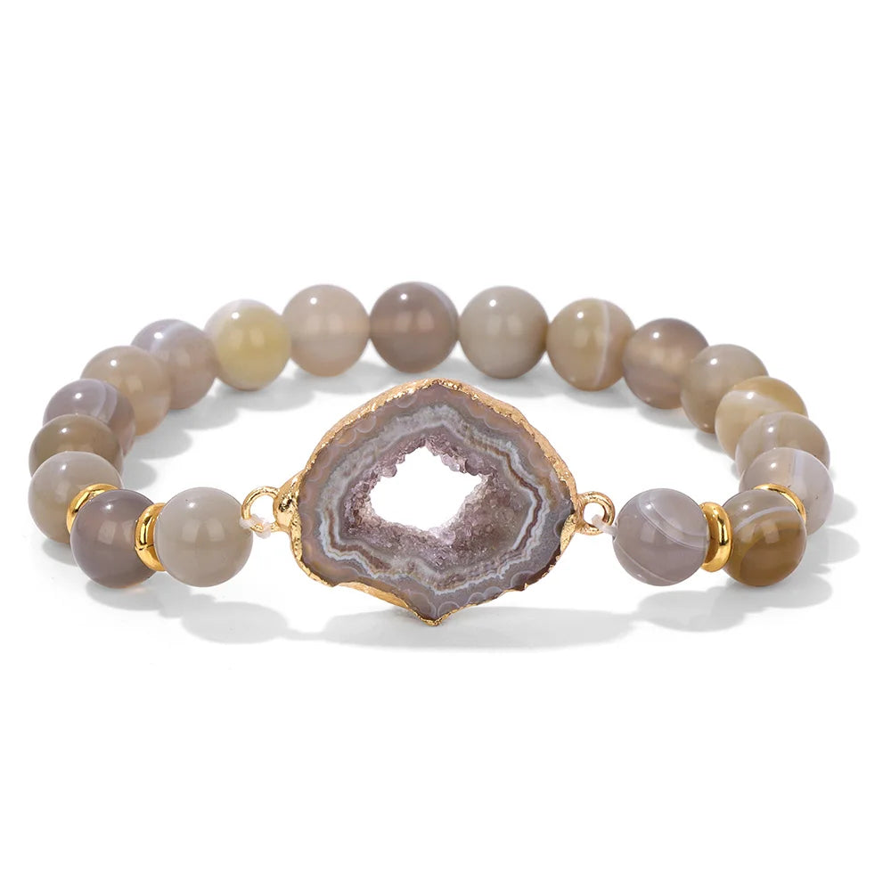 Bracelet with agate stones and gold accent on a white background