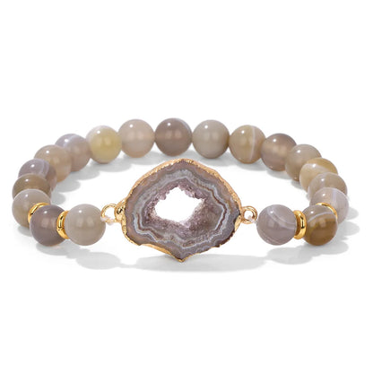 Bracelet with agate stones and gold accent on a white background