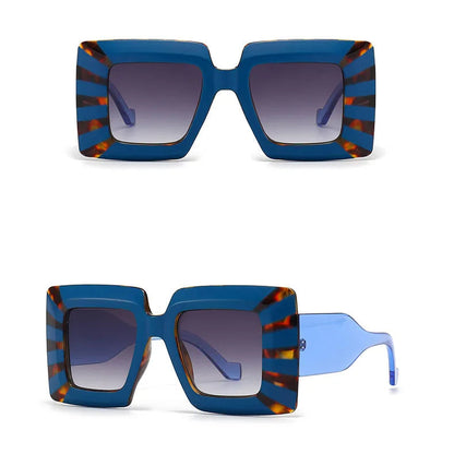 Blue and grey sunglasses with striped frame on a white background