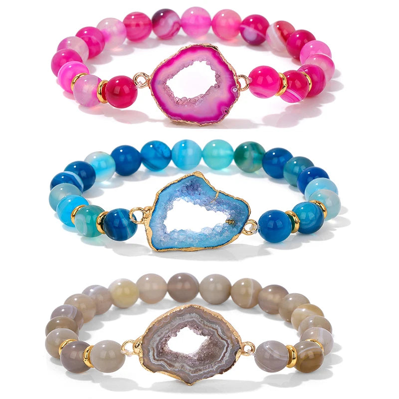 Three beaded bracelets with geode-style clasps on a white background