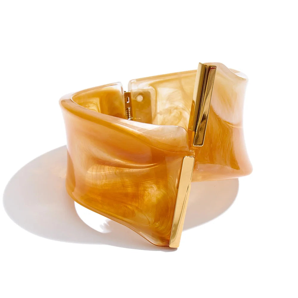Gold bracelet with a white background