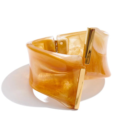 Gold bracelet with a white background